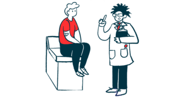 A doctor talks to a patient who sits on the end of an examination table.