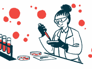 A scientist wearing gloves and safety goggles works with a petri dish in a lab alongside a rack of test tubes.