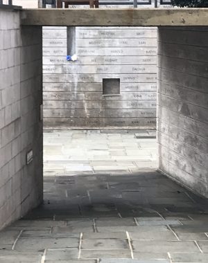 pulmonary fibrosis lung transplant | Pulmonary Fibrosis News | photo of a short tunnel, with floors and walls of rectangular stone, leading to a courtyard of the same materials. Etchings are visible in the courtyard wall stones.