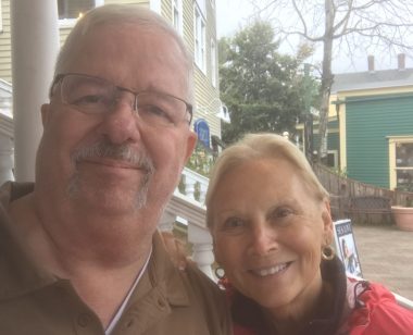 ipf diagnosis | Pulmonary Fibrosis News | photo of Sam Kirton and Sharon Eon outdoors in front of a couple of houses. We see them in head and shoulders shots.