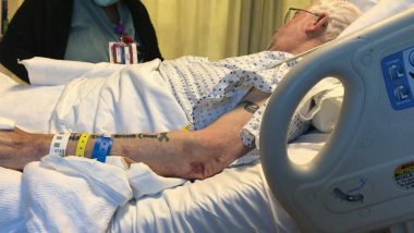 pneumonia after lung transplant | Pulmonary Fibrosis News | Sam Kirton lies in a hospital bed while a nurse administers intravenous medications through a PICC line while Sam battles pneumonia.