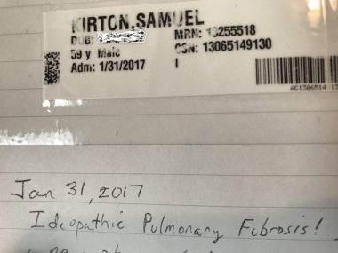  A dark photo shows a hospital wristband taped to a piece of lined notebook paper. Underneath is written, " Jan. 31, 2017, Idiopathic pulmonary fibrosis!"